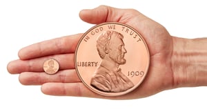 1 lb copper and penny in hand